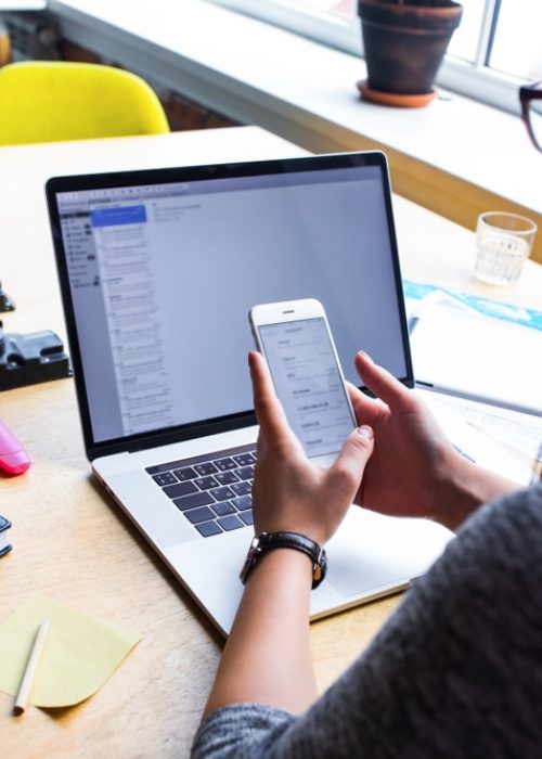 Business,Woman,Reading,Text,Message,On,Mobile,Phone,During,Work